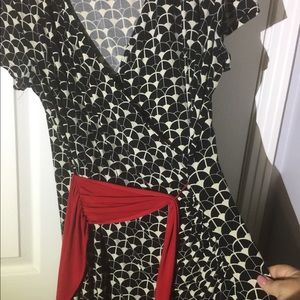 Black/white patterned dress with attached red sash